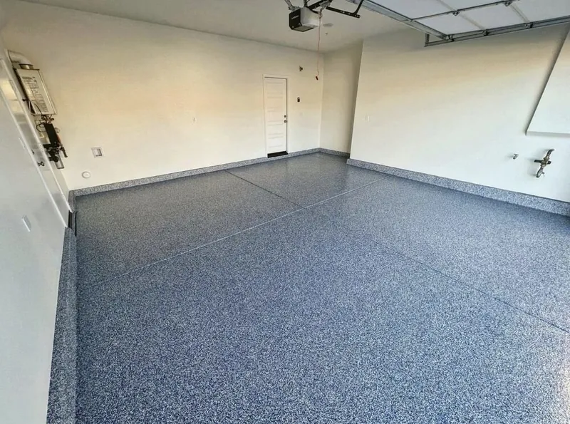 Glossy blue-gray flake epoxy garage floor coating in a bright San Diego County home garage